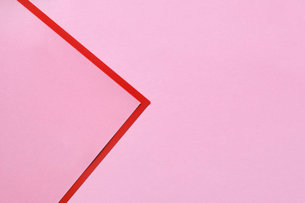 A pink sheet of paper with a red-pink corner and place for text. Fashionable and creative background, minimalism - Fotografie, Obrázek