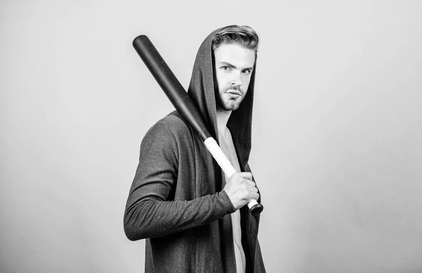 Bully mood. Bad boy concept. Man handsome bully guy with baseball bat. Sport equipment. Strong and confident. Aggression masculinity strong temper. Sportsman strong macho looks threatening with bat - Foto, Bild