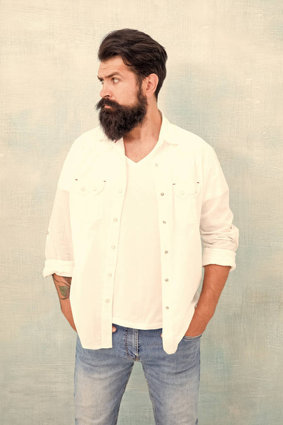 Masculinity concept. Hipster long beard and mustache. Male temper brutality. Brutal macho casual outfit gray background. Simple and casual. Casual style daily life. Summer season fashion trend - Fotó, kép
