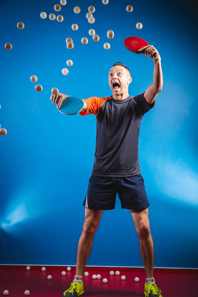 young man playing ping pong against a grunge background - Photo, Image