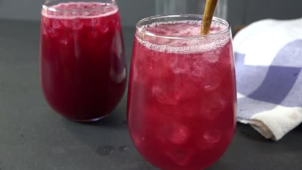 Stirring a drink closeup in slow motion - Materiał filmowy, wideo