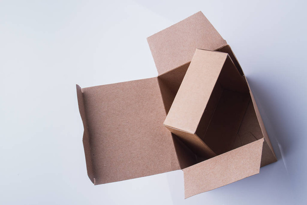 Small cardboard box inside a big one. - Foto, afbeelding