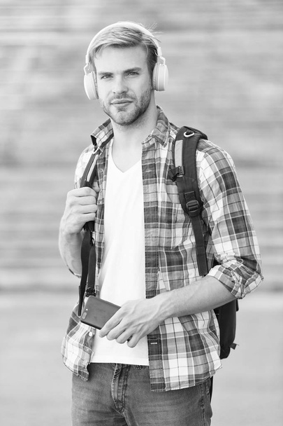appealing look. school life. Listen music. Modern and digital youth. trendy man. College student earphones smartphone. Online education. Audio book concept. Educational technology. student e learning - Fotoğraf, Görsel
