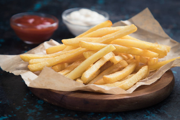 French fries with ketchup and mayonnaise - 写真・画像