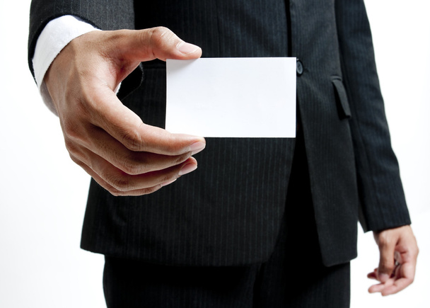Business man holding blank note card - 写真・画像