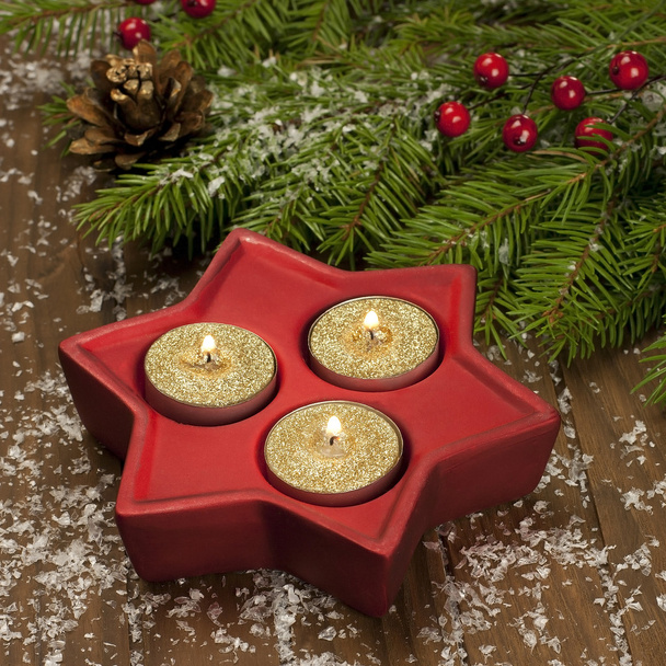 Christmas candles on a wooden surface - Foto, Bild