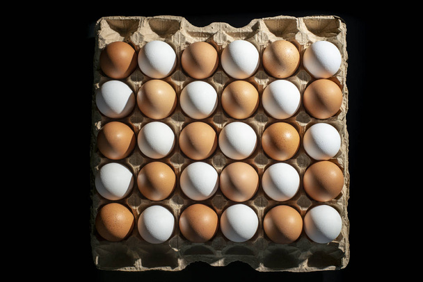 packing of yellow and white chicken eggs - Φωτογραφία, εικόνα