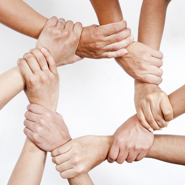 Small group of business people joining hands - Photo, Image