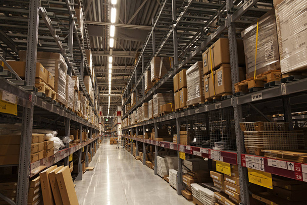 a large warehouse with packages in yellow tone - Foto, Imagen