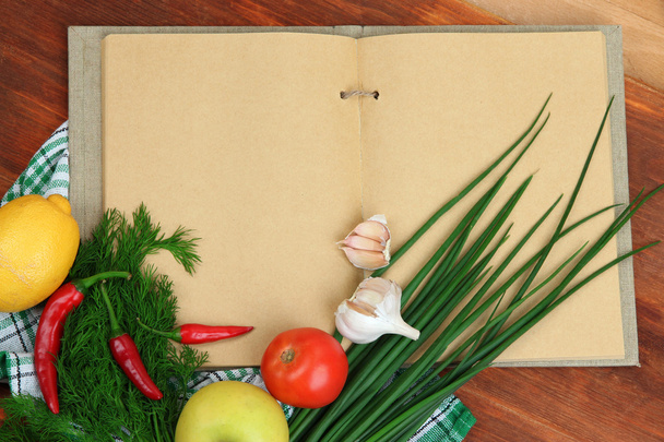 Cooking concept. Groceries with empty cookbook close up - Zdjęcie, obraz