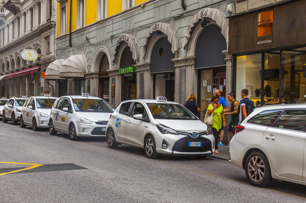 Trieste, Italy, on August 5, 2019. City view. Beautiful picturesque street in the historical part of the city. Taxi cars parked near the sidewalk - Foto, Imagen