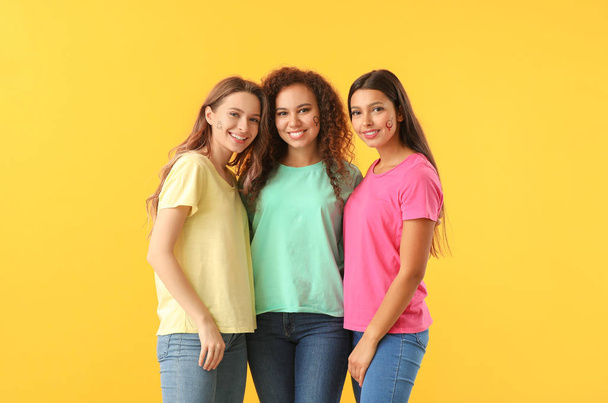 Young women on color background. Concept of feminism - Foto, imagen