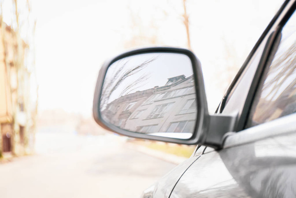 Side mirror of modern car on city street - Φωτογραφία, εικόνα