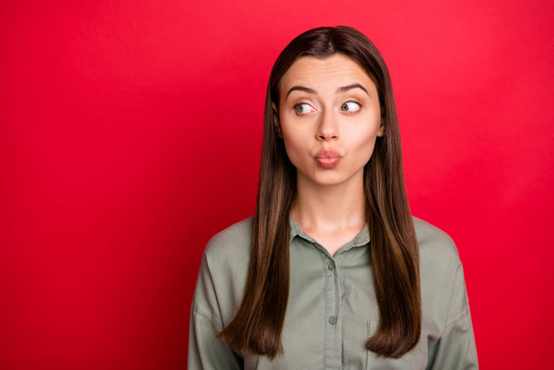 Close-up portrait of her she nice-looking attractive lovely funky funny lovable cheerful straight-haired girl sending kiss looking aside isolated over bright vivid shine vibrant red color background - Foto, Imagen