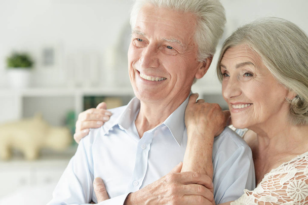 cheerful senior couple embracing at home  - 写真・画像