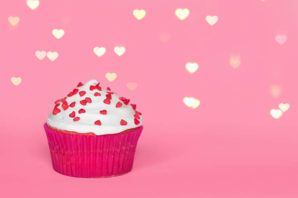 pink cupcake on pink background with bokeh - Foto, imagen
