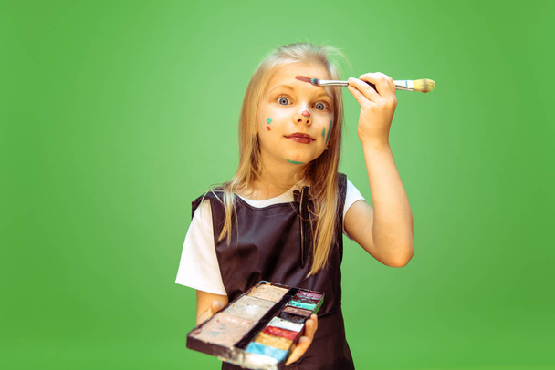 Little girl dreaming about future profession of makeup artist - Φωτογραφία, εικόνα