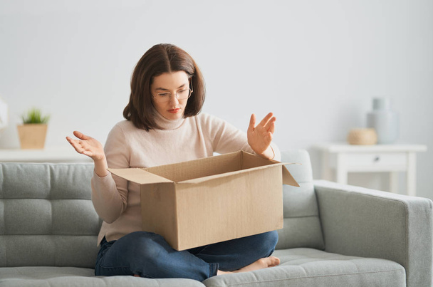 woman is holding cardboard box - Photo, Image