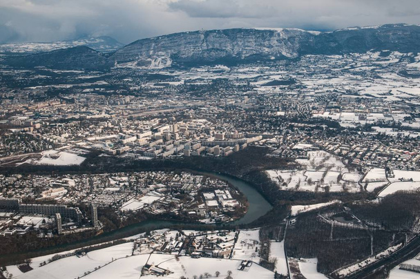 An aerial view of Geneva with the river snaking through and mountains in the background - Valokuva, kuva