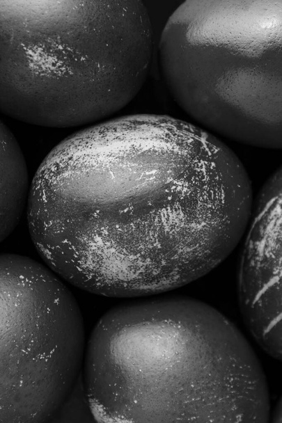 Easter eggs painted in monochrome black and white style close up, with stains, scuffs, scratches. handmade painted eggs. Flat lay - Foto, Imagem