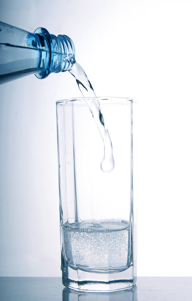 water pouring into glass, isolated on white - Valokuva, kuva