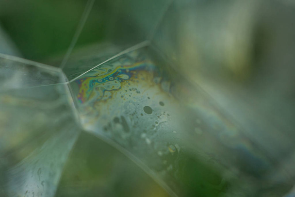 Soap bubble abstraction very close with movement and different colors - Photo, Image