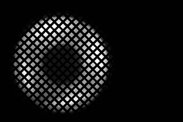 abstrakte Makro-Nahaufnahme heller Lichter über einem Gitter - Foto, Bild