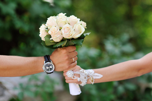groom gives the bride a bouquet of roses - Photo, Image