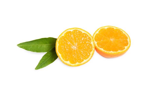 Halves of fresh ripe tangerine with leaves isolated on white. Citrus fruit - 写真・画像