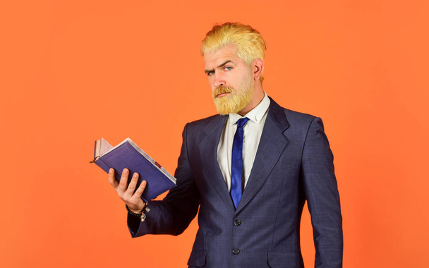 Feed the mind serious businessman hold notebook. mature man dyed beard and hair. reading book. check his notes. daily schedule. male professional teacher. after barbershop. business school education - Foto, Bild
