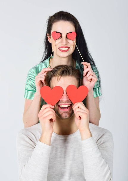 Man and girl in love. Valentines day and love. Romantic ideas celebrate valentines day. Happy together. Valentines day concept. Man and woman couple in love hold red paper heart valentines cards - Fotografie, Obrázek