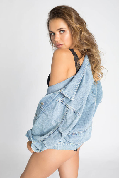 Sexy young woman in underwear and denim jacket. - Photo, image