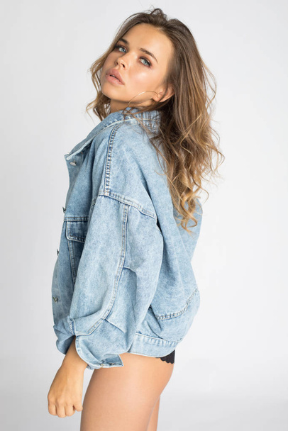 Sexy young woman in underwear and denim jacket. - Photo, image