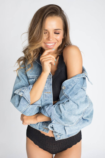 Sexy young woman in underwear and denim jacket. - Foto, immagini