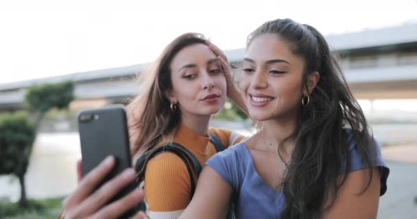 Girlfriends Take A Selfie at waterfront at sunset in summer - Felvétel, videó