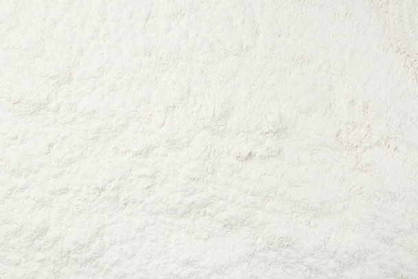 Pile of organic flour as background, top view - Foto, Bild