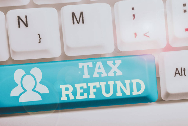 Conceptual hand writing showing Tax Refund. Concept meaning refund on tax when the tax liability is less than the tax paid Keyboard with note paper on white background key copy space - Photo, Image