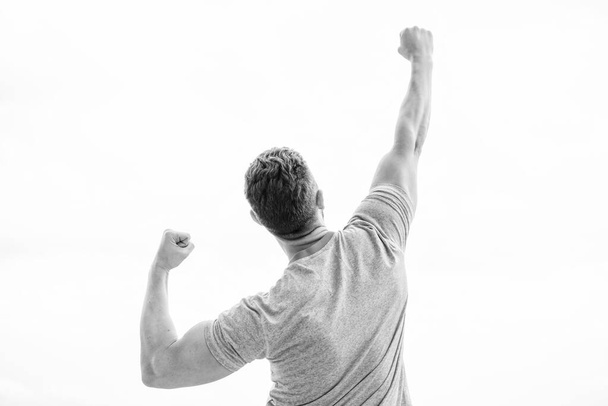 Emotional explosion. muscular back man isolated on white. Coach sportsman in vest. Towards success. Celebrate success. Behavior successful man. winner happy with raised fists - Foto, Imagen