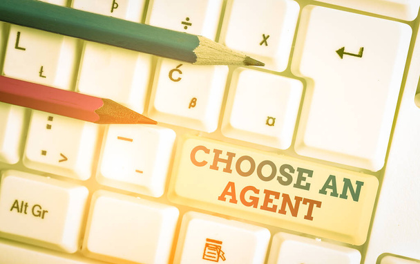 Writing note showing Choose An Agent. Business concept for Choose someone who chooses decisions on behalf of you White pc keyboard with note paper above the white background - Photo, Image