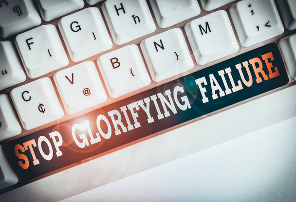Text sign showing Stop Glorifying Failure. Business photo text do not let Breakdown Rule your life Try again White pc keyboard with empty note paper above white background key copy space - Photo, Image