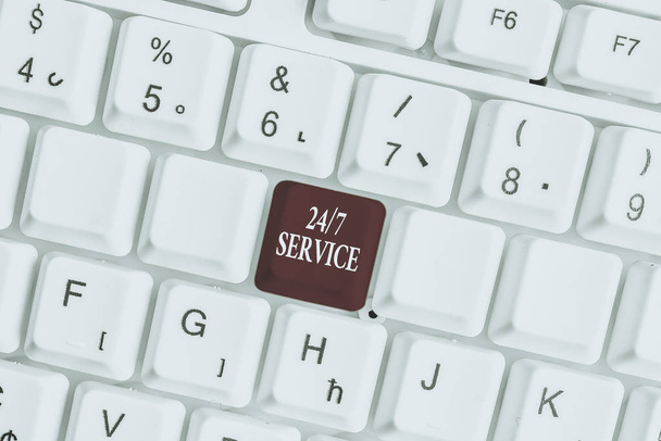 Text sign showing 24 Or 7 Service. Business photo text Always available to serve Runs constantly without disruption White pc keyboard with empty note paper above white background key copy space - Photo, Image