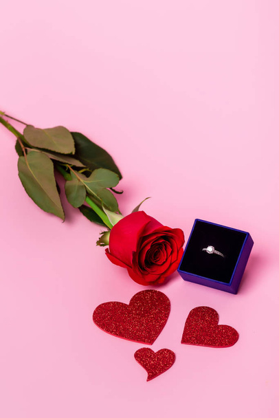 Engagement ring and rose. - 写真・画像