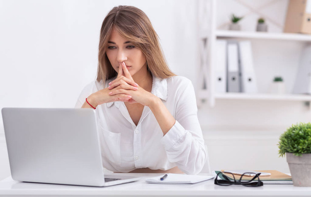 Thoughtful Lady Thinking Working On Laptop Sitting In Office - Photo, Image