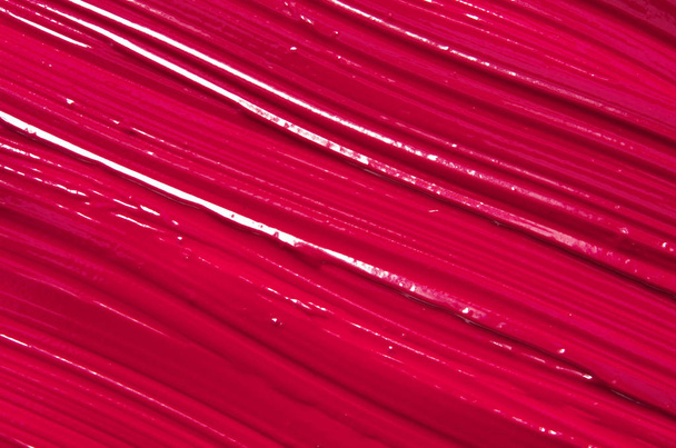 Spalmare e consistenza di rossetto rosso o vernice acrilica. - Immagine
 - Foto, immagini