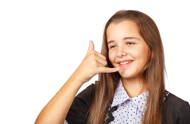 teen girl shows phone gesture - Photo, image