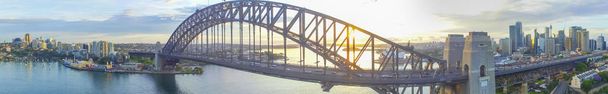 Sydney Harbour Bridge at dusk. Panoramic aerial view from drone - Photo, Image
