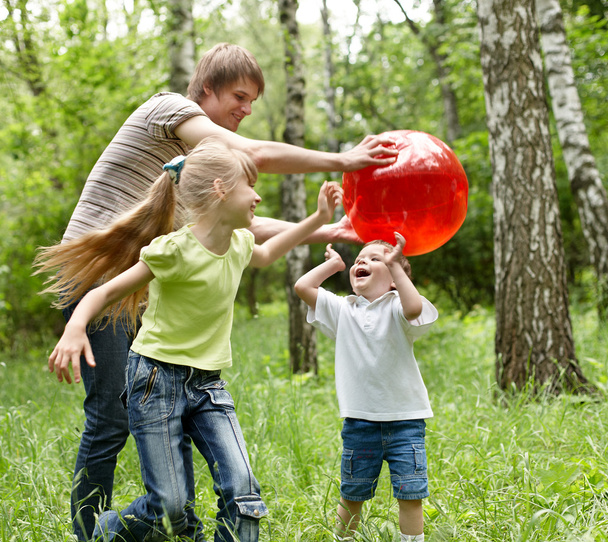 Outdoor happy family plaing ball . - Fotografie, Obrázek