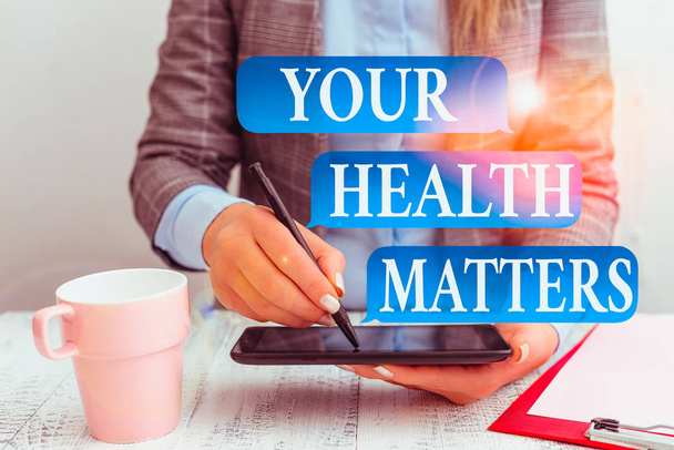 Writing note showing Your Health Matters. Business concept for Physical Wellness is Important Stay Fit and Healthy Business concept with mobile phone in the hand - Photo, Image