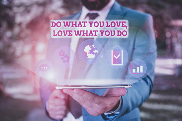 Writing note showing Do What You Love Love What You Do. Business concept for you able doing stuff you enjoy it to work in better places then Male human wear formal suit presenting using smart device - Foto, afbeelding