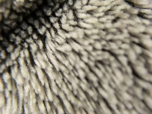Background or texture from single-tone spark fabric with tufts. Macro. Plush material. Textiles. - 写真・画像